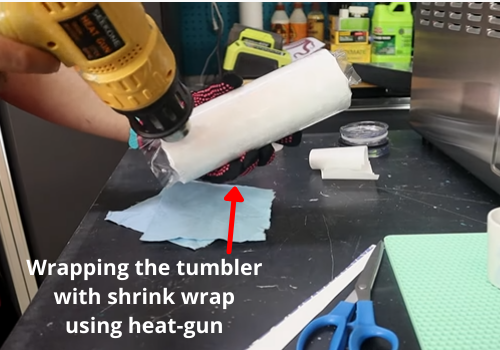 Step 5 Wrapping the tumbler with shrink wrap using heat-gun